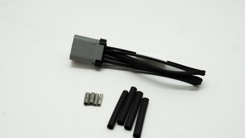 Grey and black wiring assembly kit on a white background with black components. 